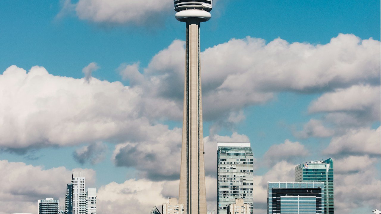 CN Tower breaking through clouds, shot from the Islands